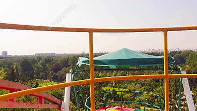 Areal slow motion footage of urban city made from ferris wheel. Concept