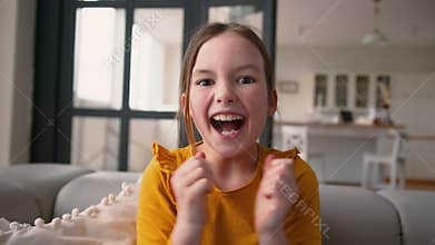 Happy cheerful little Caucasian girl kid portrait daughter laugh amaze schoolgirl winning rejoicing celebrate victory
