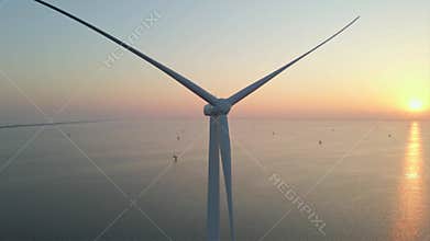 European Wind turbine Construction, Windmill in the ocean at sunset, showcasing renewable energy innovation