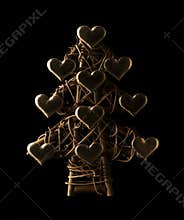 Christmas tree made from sticks and golden hearts