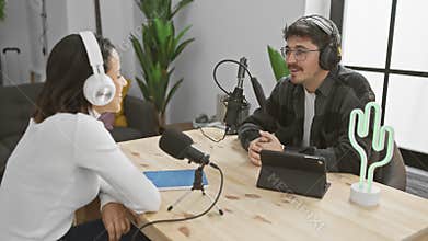 Woman and man podcasting together in a modern radio studio with microphones and headphones