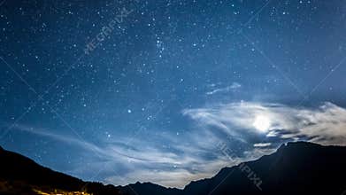 Night sky stars and moon across mountain