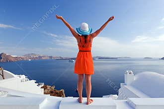 Happy tourist woman on Santorini island, Greece. Travel