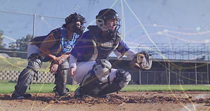Crouching catchers holding mitts at baseball home plate, with helmets and chest protectors