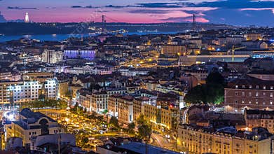Lisbon after sunset aerial panorama view of city centre with red roofs at Autumn day to night timelapse, Portugal