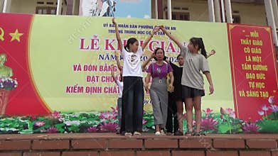 Vietnamese schoolgirls are practicing performing arts for the opening day of the new school year