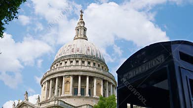 Black telephone booth with the dome of St. Paul's Cathedral