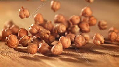 Chickpeas fall on the table. Filmed on a high-speed camera at 1000 fps.