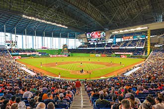 Fans watching a baseball game at the Miami Marlins Stadium