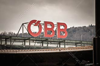 GRAZ, AUSTRIA - DECEMBER 22, 2024: Large red OBB letters sit atop a building in Graz. OeBB, or Osterreichische Bundesbahnen, is