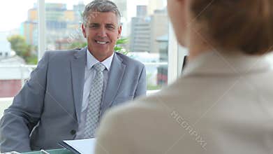 Businessman shaking hands with a woman