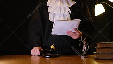 Judge in robe reading a verdict and leaving the courtroom