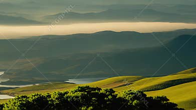 Morning mist filling mountain valley at sunrise