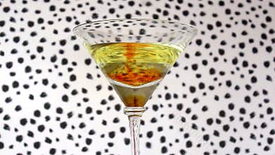 Cocktail drink with red drops