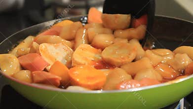 Someone stirs up Korean specialties. spicy Korean specialties