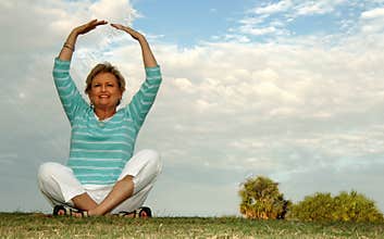 Fit senior woman meditation/praise