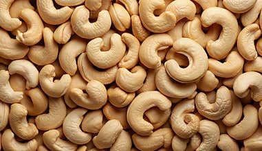 Many tasty cashew nuts as background, top view