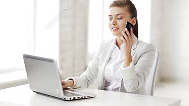 Attractive office worker taking phone call