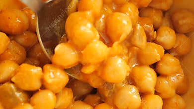 Chickpeas cooked in rich sauce with spices and herbs