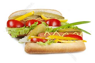 Two hot dogs with fresh vegetables