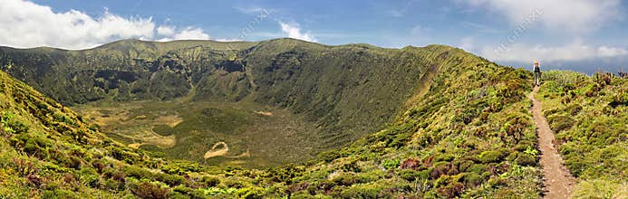 Hiking along the crater rim of Caldeira of Faial, Azores