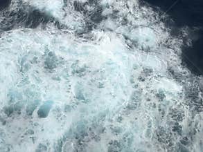 Sea water waves with foamy wave.