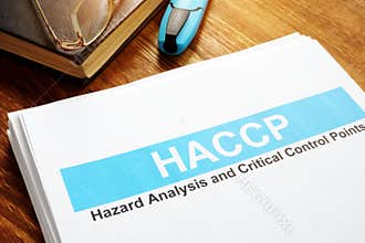 HACCP Hazard Analysis and Critical Control Points report on table
