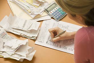 Woman Filling Out Tax Form