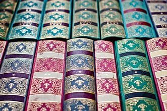 Old books background. Colorful ornamental book binding.