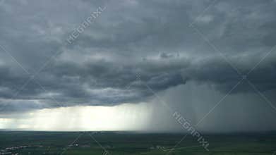 Time lapse of rainy clouds over the plain
