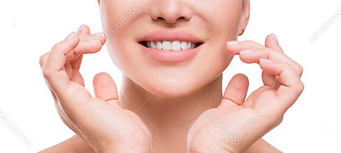 Woman touching her face by hands. Applying cream on a perfect smooth soft skin.