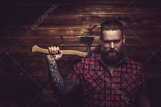 Brutal man with beard and tattooe.