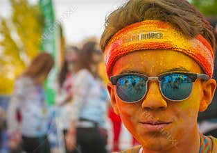 Colorful street boy portrait with sunglasses at The Color Run