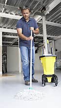 Cleaner mopping office floor