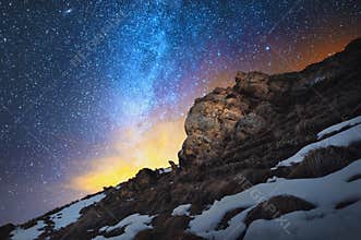 Night scenery done on long exposure. A beautiful Caucasian landscape of red rocks against the background of the cold