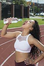 Stunning African-American fitness model on outdoor track