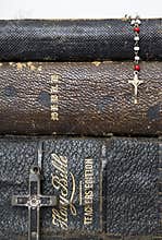 Three Antique Stacked Bibles with Two Antique Crosses Rosary on
