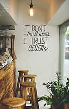 I don`t trust words, I trust actions inspirational quote on a wall