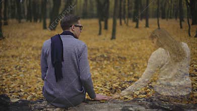 Guy is sad and missing his girlfriend, feeling presence of her soul alongside