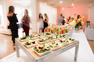 Healthy organic gluten-free delicious green snacks salads on catering table during corporate event partyÑŽ