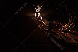 A crown of thorns on a wooden background. Easter Theme