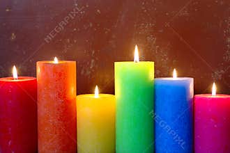 Burning Candles In Rainbow Colors