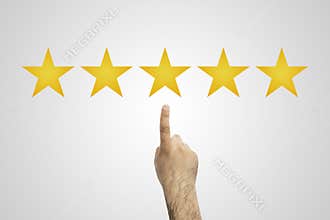 Rate. 5 stars. Hand click on five yellow stars to increase rating. Customer reviews, rating, classification concept.