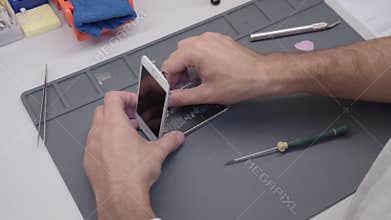 Close-up video showing process of mobile phone repair
