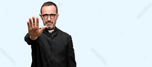 Handsome senior man isolated over blue background