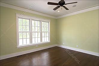 Empty bedroom with windows