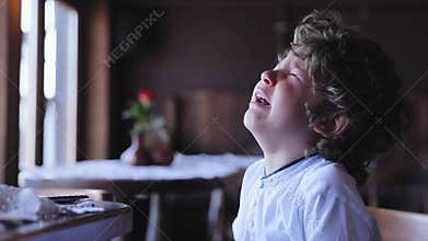Boy crying. Upset little child cry at cafe