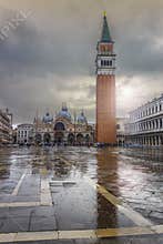 San Marco square under the rain with Bell Tower and Saint Mark& x27;s Basilica. The main square of the old town. Venice, Italy.