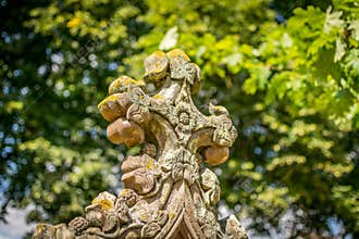 A close up of decorative cross outside.