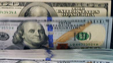 Paper money moving on a counter line, checked in a machine.